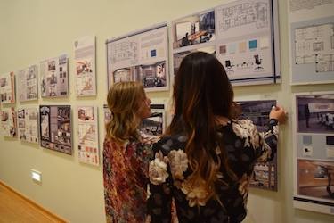 Two students discuss projects in the Interior Design and Fashion program.