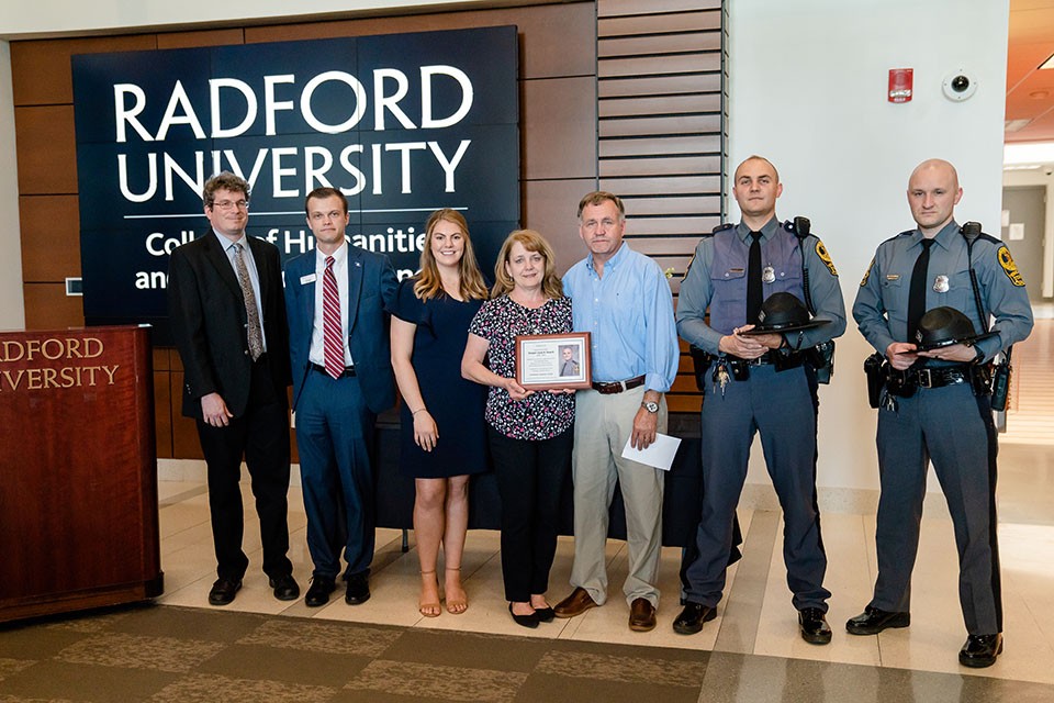 Left to right: Stephen Owen, chair of the Department of Criminal Justice; Cody Hartley; Caroline Bamford, Rebecca and Mike Dowell; and State Troopers Jonathan Barbour and London Atkins.