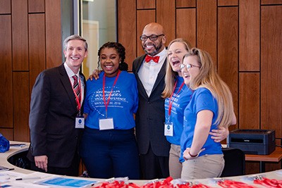 Interim Dean of CHBS Matt Smith, left, Radford University President Brian O. Hemphill, Radford student Starr Woods and two members of the class that assisted with planning the VACAS conference.