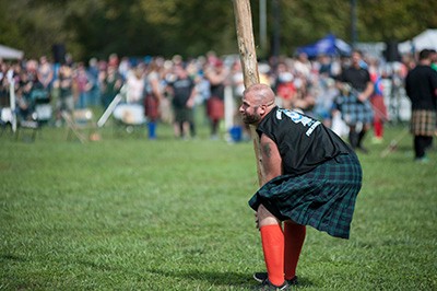 Participant in the Highlanders Games partakes in the caber toss at Highlanders Festival.