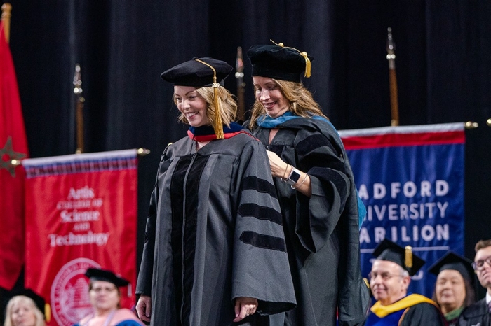 An alumna cherishes her proud moment at the RUC Winter Commencement.