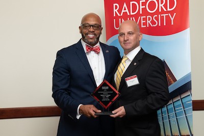 Radford University President Brian O. Hemphill, Ph.D., left, is pictured with Outstanding Alumnus Award recipient Robert P. Brager ’89.