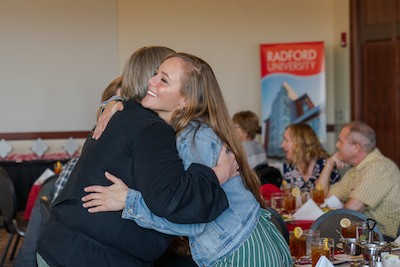 Alumni greet each other and celebrate Radford University during the awards luncheon.