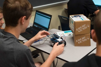A student programs an Arduino robot at Radford University's first-ever Cyber Camp in Davis Hall.
