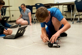 Students were tasked with navigating their robots through mazes that were taped throughout classrooms and hallways.