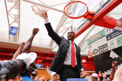 Coach Mike Jones cuts down the nets after Radford's thrilling victory over Liberty in the 2018 Big South Championship.
