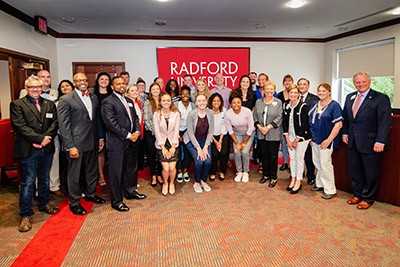Members of the Radford University Women's Basketball Team bet with the BOV to celebrate their successful season.