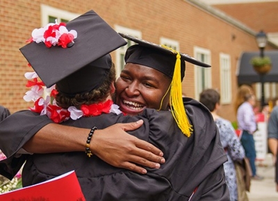 Two proud Highlanders share an embrace during the commencement festivities.