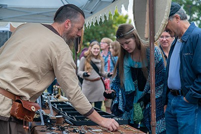 Guests explore one of the many vendors at the Highlanders Festival.