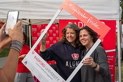 Two alumni pose for a picture during the 2019 Alumni Village.
