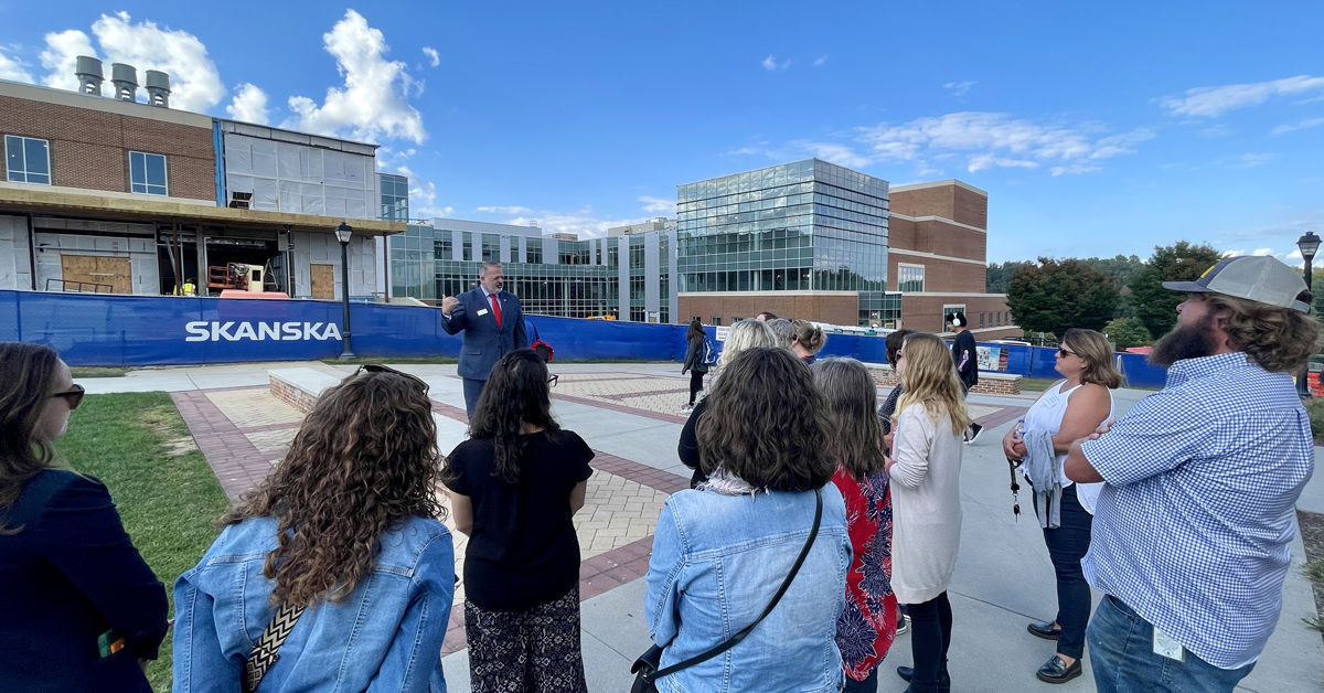 College of Visual and Performing Arts interim Dean Tim Channell briefs area educators on the design and programming of the Artis Center for Adaptive Innovation and Creativity.