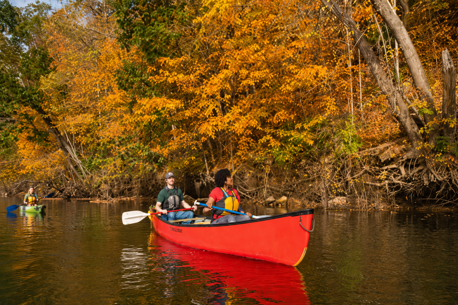 Canoe on river with two people