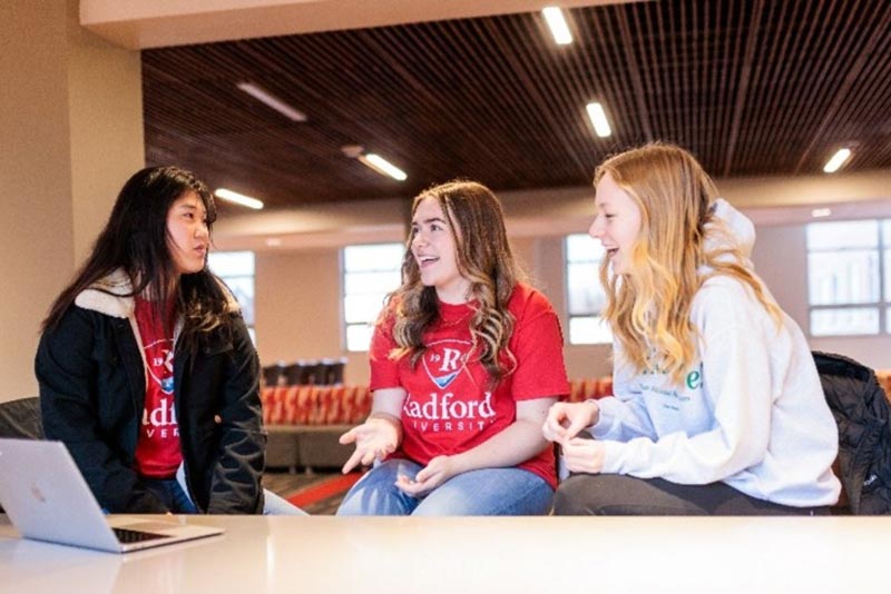 students sitting together, talking