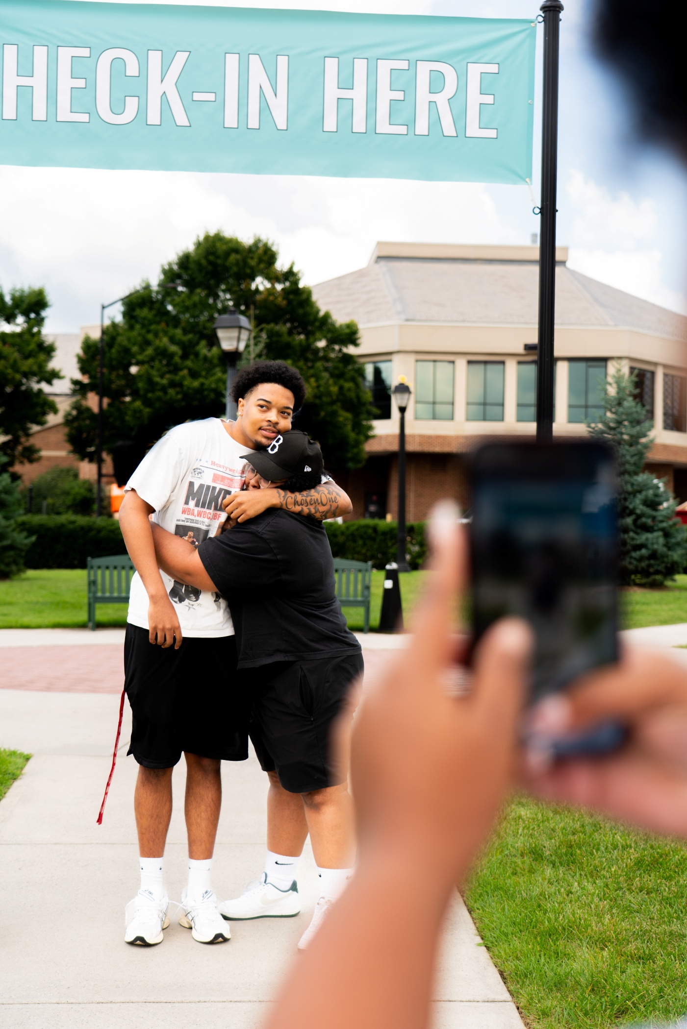Student and parent hug