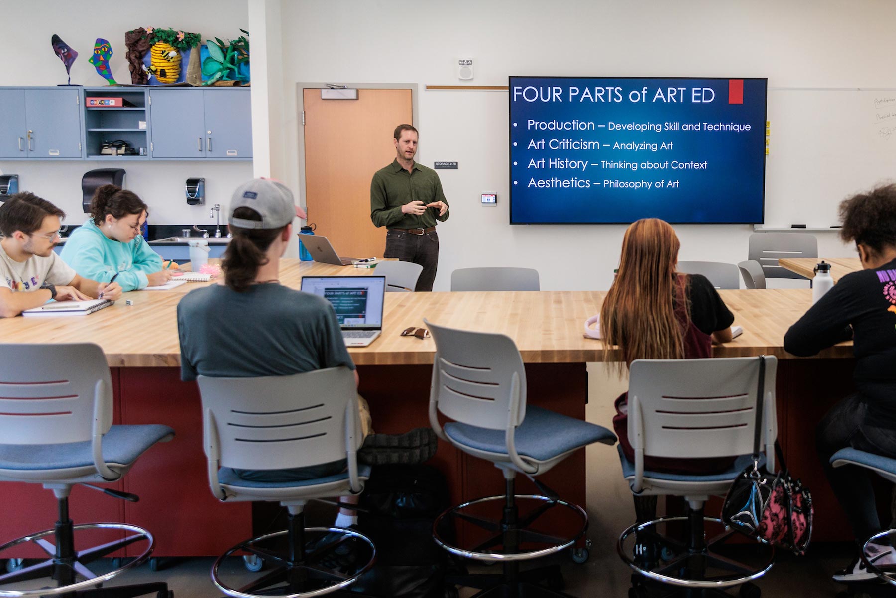 art professor in classroom with students