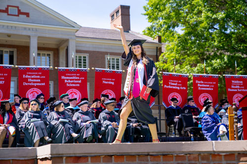 Student walking across stage
