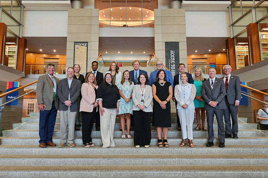 A delegation of supporters stand in the Library of Virginia.