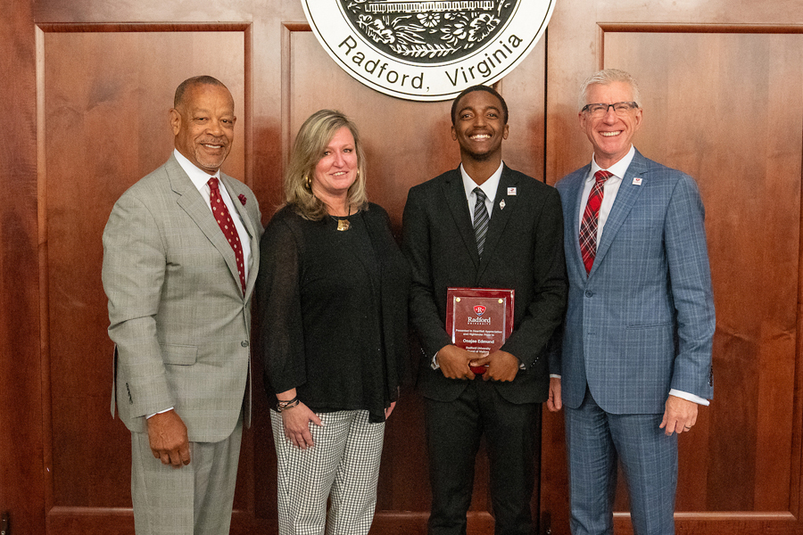 (Left to right) Board of Visitors Rector Marquett Smith, Vice President for Student Affairs Susan Trageser, student represenative Onajae Edmund and President Bret Danilowicz pose for a photo.