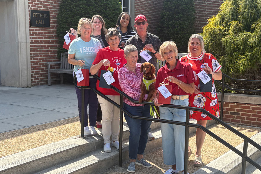 CEHD faculty, staff and alumni gather outside of Peters Hall on Radford's campus.