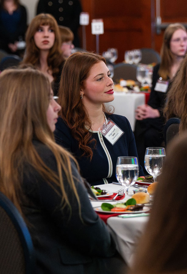 student at etiquette dinner