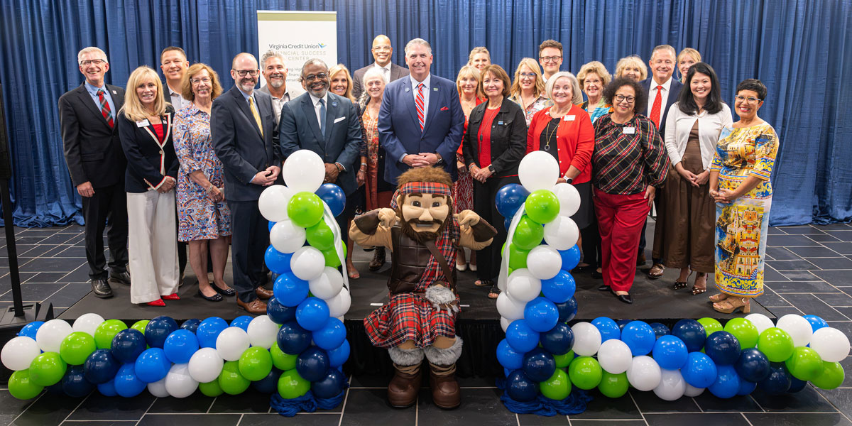 leadership posing for the opening of the center