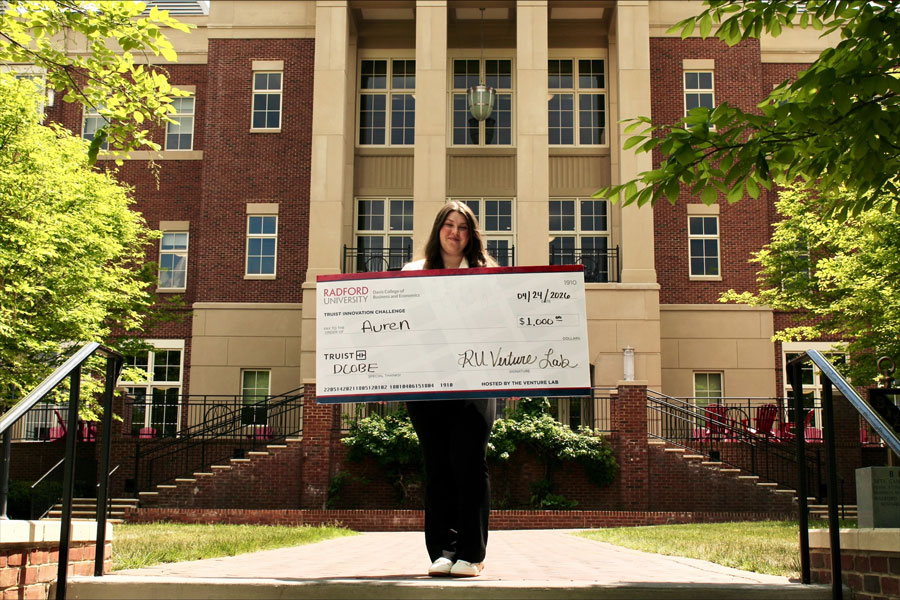 INNO26 winner Emily Lewis poses with her prize.