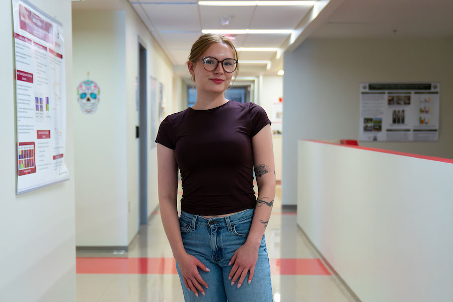 Foods and Nutrition major Kaitlin O'Brien stands in a hallway on Radford University's campus.