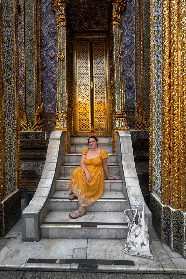 students sitting on stairs in Thailand