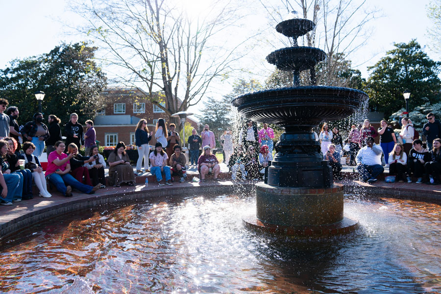 students at the fountain on campus