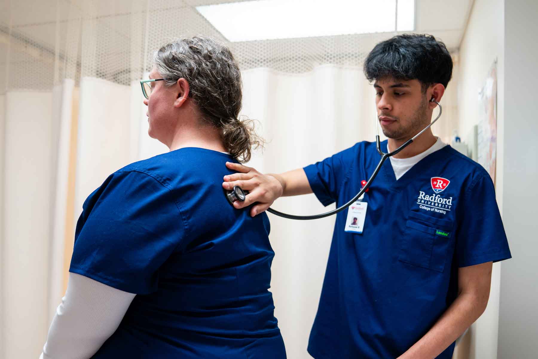 nurse student in classroom with professor