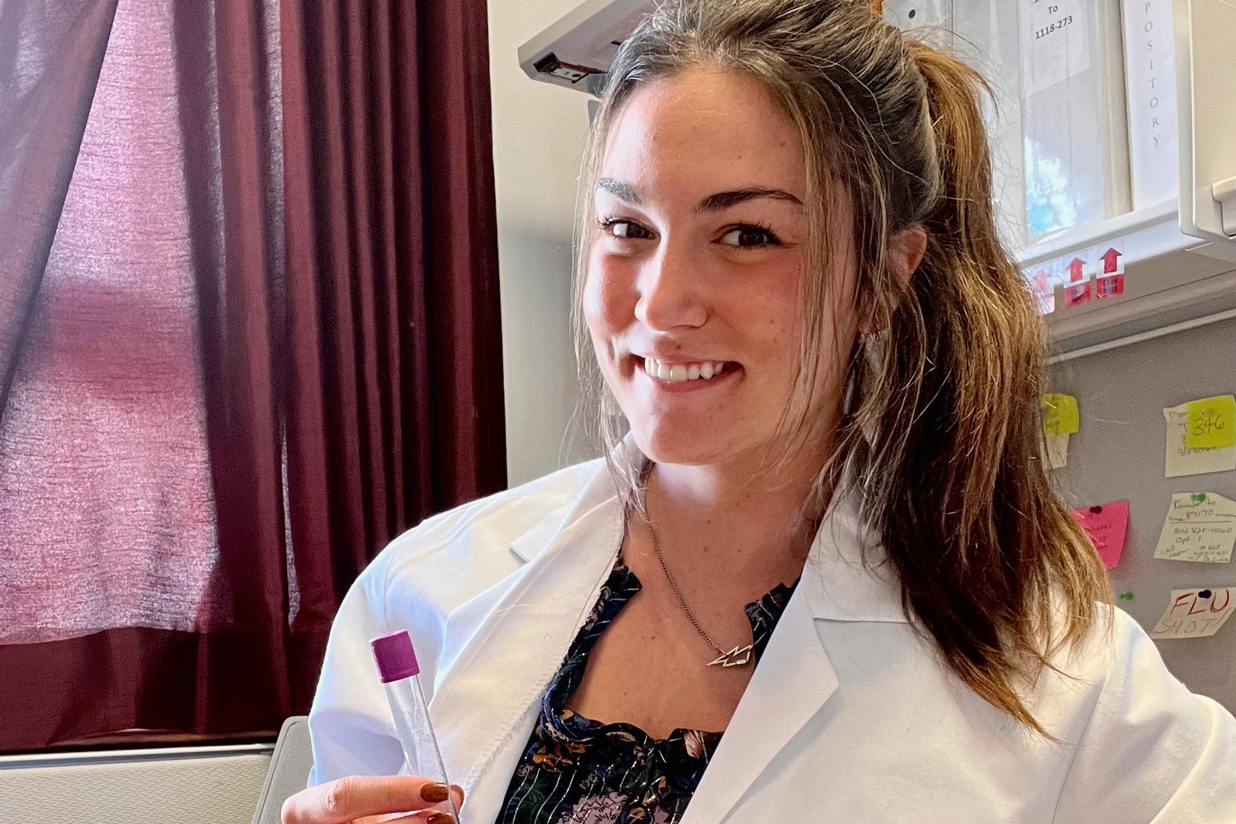 clinical research student in lab coat