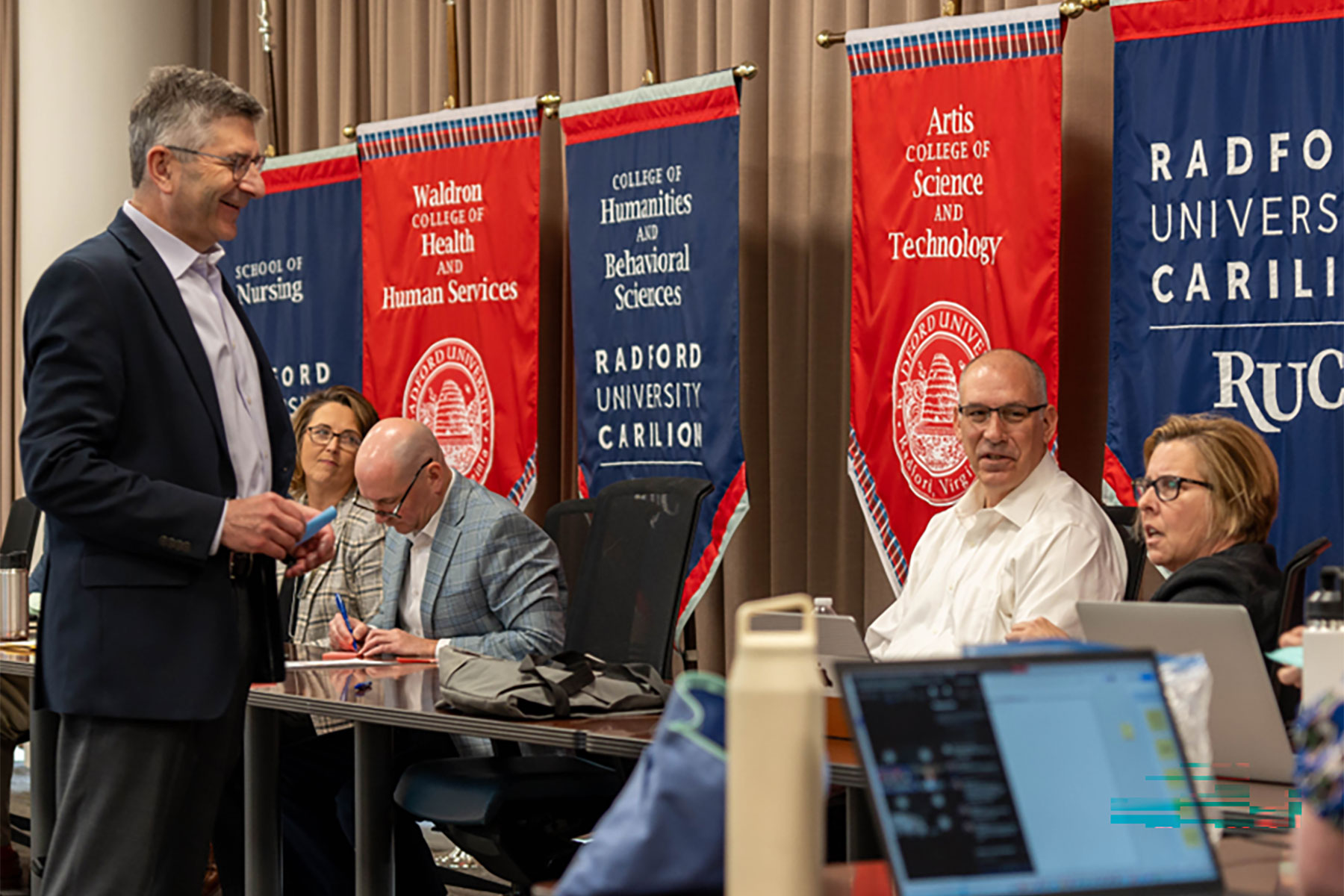 Members of the Perkins & Will design team meeting with Radford University leadership, faculty and staff